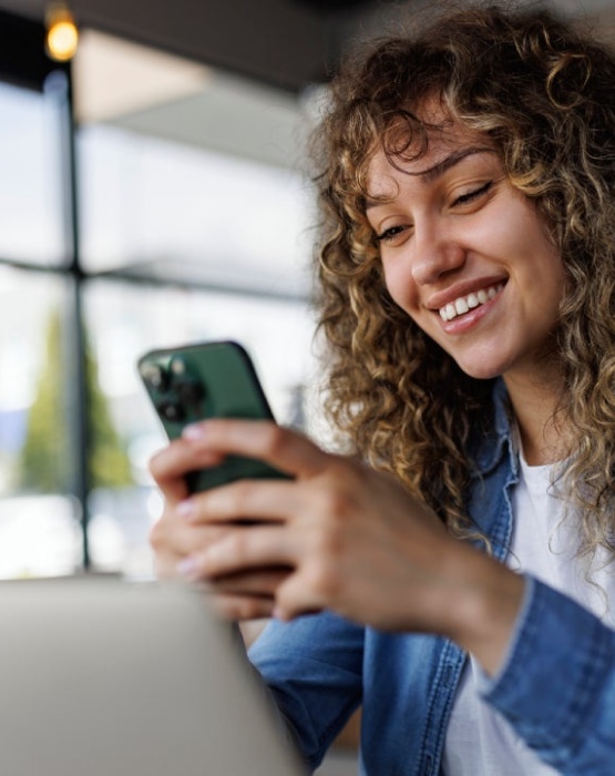 a woman looking at her mobile phone