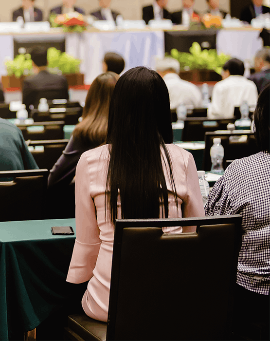 Woman at a Shareholder's meeting