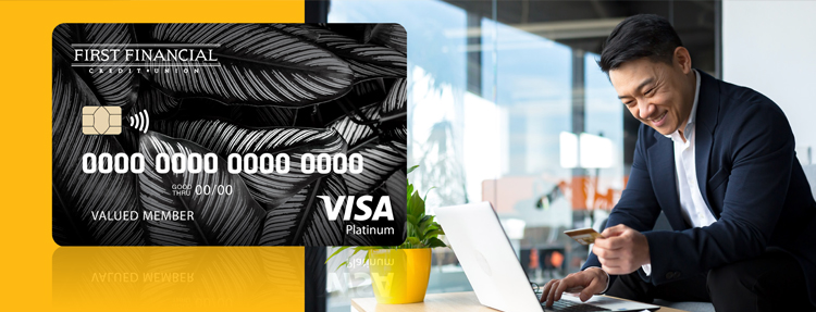 Man using his First Financial Platinum Visa card to complete a balance transfer.